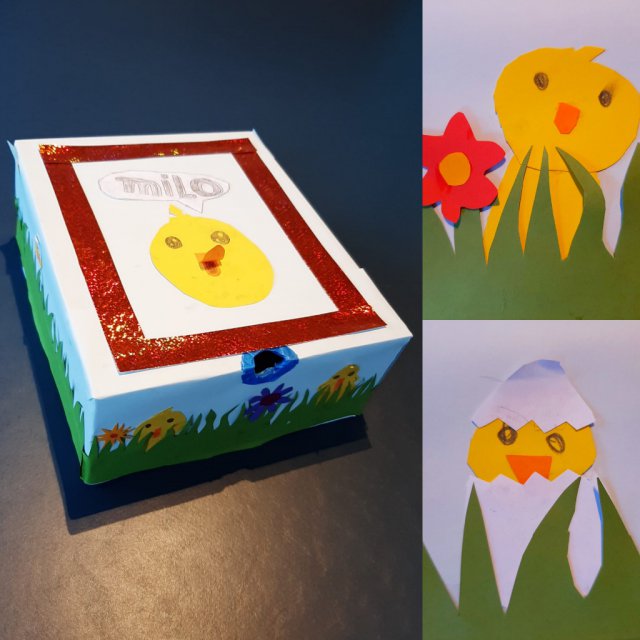 Paasdoos knutselen – de leukste ideeën voor het paasontbijt op school. Zoals deze  paasdoos met een kuiken op de bovenkant. Helemaal rondom maakte is er een versiering van gras met verstopte kuikentjes en bloemen.