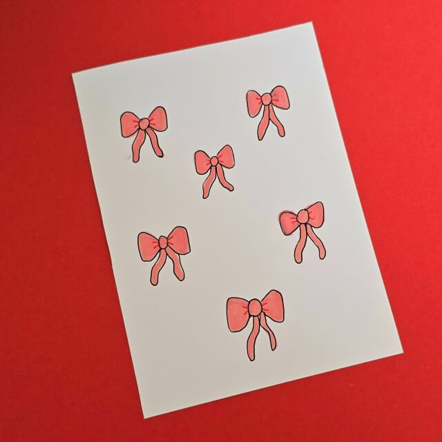 Strik tekenen en knutselen: leuke ideeën voor strikken. Met ideeën voor peuters, kleuters, kinderen, tieners en volwassenen. Deze kaart met strikjes tekening is leuk voor een verjaardag of kerst.